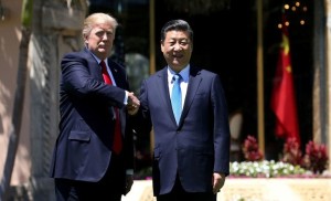 U.S. President Donald Trump (L) and China's President Xi Jinping shake hands while walking at Mar-a-Lago estate after a bilateral meeting in Palm Beach, Florida, U.S., April 7, 2017. REUTERS/Carlos Barria - RTX34MII