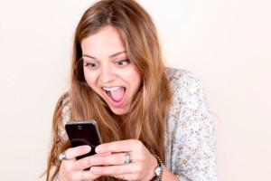 Woman-smiling-using-phone